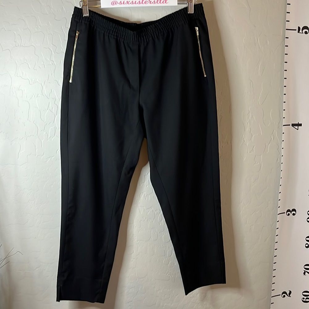 H&M black pull on trousers with zippered pockets. Size 14. Single back pocket.